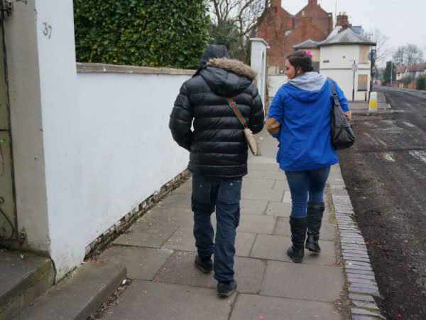 male and female walking away from the camera