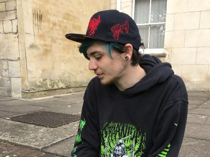 young man in cap and hoodie