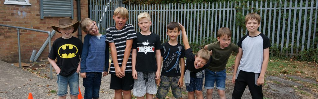 group of young boys pulling funny faces